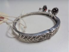 A pair of Art Deco silver and marcasite earrings, together with a silver and marcasite bangle,