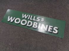 A hand painted metal sign "Wills Woodbines"