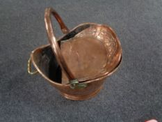 An antique copper coal bucket together with a copper embossed scoup