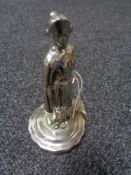 An early motoring car mascot of a chrome plated Edwardian lady,