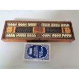 An antique inlaid cribbage board and cards