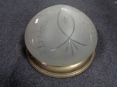 A 20th century etched glass domed light shade with brass mount