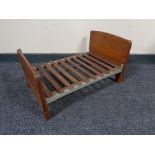 An early 20th century scratch made doll's double bed, with oak head and footboard,