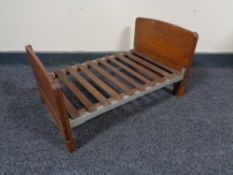 An early 20th century scratch made doll's double bed, with oak head and footboard,