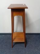 A Victorian inlaid mahogany plant stand