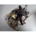 A bag containing assorted lady's and gent's vintage watches and movements
