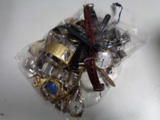 A bag containing assorted lady's and gent's vintage watches and movements