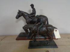 Two resin figures of a horse and jockey