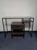 A metal framed glass top dressing table and matching bedside stand