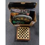 A chessboard with pieces, poker set, roulette wheel,