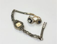 Two 9ct gold dress rings (one with split shank) and a marcasite set lady's wristwatch (3)