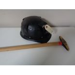 A 20th century Huwood light type miner's helmet together with a pickaxe
