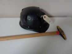 A 20th century Huwood light type miner's helmet together with a pickaxe