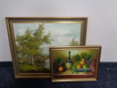 A gilt framed oil on canvas of a bridge over a river signed Percy and a still life oil painting