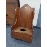 A 19th century child's commode rocking chair