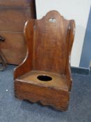 A 19th century child's commode rocking chair