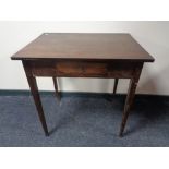 An antique single drawer side table