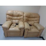 A pair of leather electric reclining armchairs
