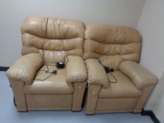 A pair of leather electric reclining armchairs