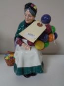 A Royal Doulton figure The Old Balloon Seller,