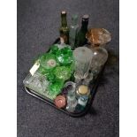 A tray of antique and later glass ware to include glass bottles, chemist's bottles,