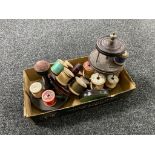 A box containing four wooden thimble and thread stands,