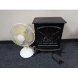 An electric heater in the form of a stove together with an oscillating table fan