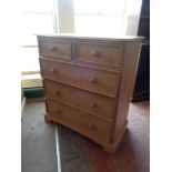 A pine five drawer chest