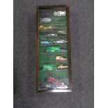 A display case containing die cast vehicles,