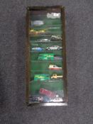 A display case containing die cast vehicles,