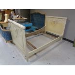 A 3'6" white painted antique French bed frame