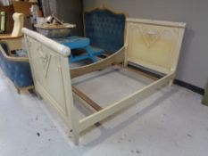 A 3'6" white painted antique French bed frame