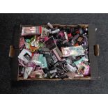 A box of nail polishes and accessories