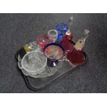 A tray of assorted glass ware to include two cranberry glass wedding bells,
