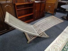 A folding teak garden lounger (a/f)