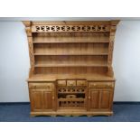 A stripped pine inverted breakfront kitchen dresser CONDITION REPORT: 184cm wide by