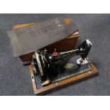 A vintage oak cased Singer hand sewing machine