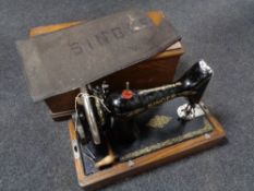 A vintage oak cased Singer hand sewing machine