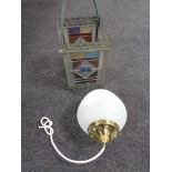 An antique metal gas hanging lamp with four stained glass panels together with a further light