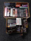 Two boxes of DVD boxed sets, action figures,