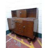 A 20th century oak sideboard