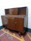 A 20th century oak sideboard