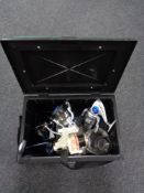 A plastic fishing box of assorted fishing reels and accessories