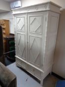 A pine double door wardrobe fitted two drawers beneath