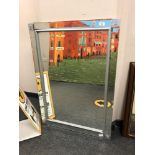 A contemporary all glass mirror,