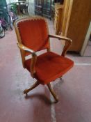 An Edwardian oak office armchair