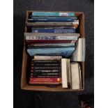 A box of books relating to art