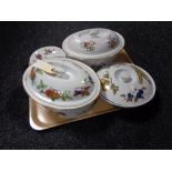 A tray of three Royal Worcester lidded oven dishes and four saucers