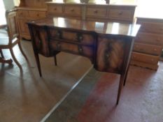 An inlaid mahogany Regency style sideboard on tapered legs