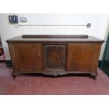 An early 20th century continental sideboard with walnut panel inset